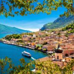 Limone,Sul,Garda,Waterfront,View,Through,Green,Leaves,Frame,,Lombardy